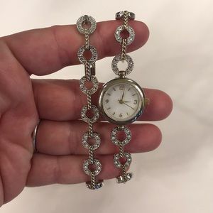 Adjustable watch with matching bracelet.